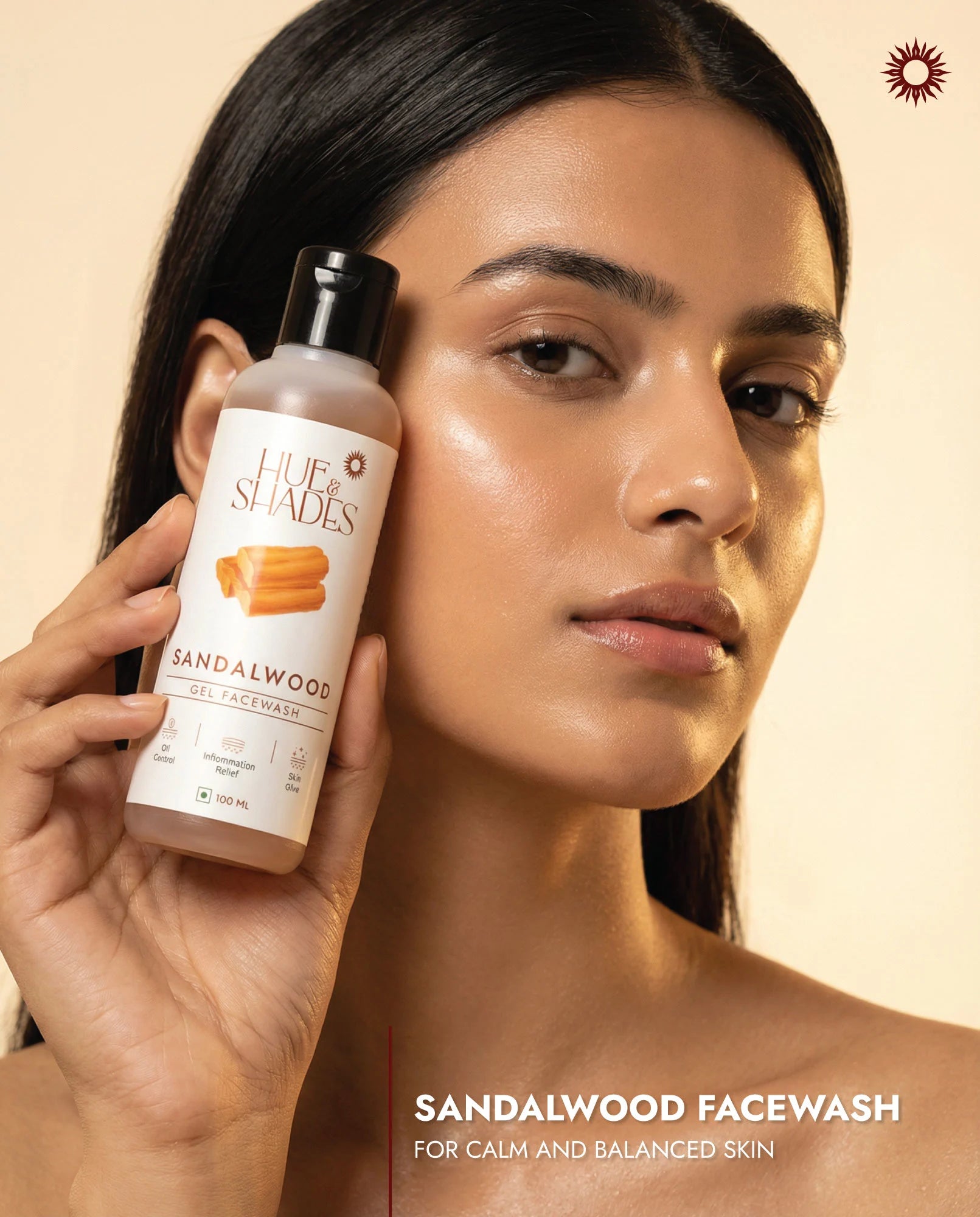 model holding bottle of natural sandalwood facewash for oily skin, with sandalwood for calm balanced skin